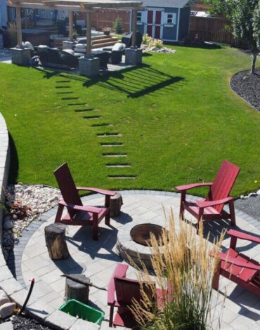 Paver patio, wood deck and new sod in Bridgwater Lakes, Winnipeg by BerryHill Landscaping